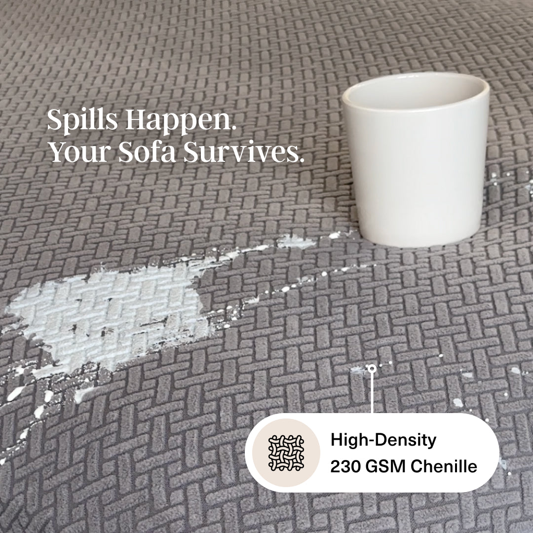 Spill beading on grey Magic Sofa Cover Classic fabric next to a white cup