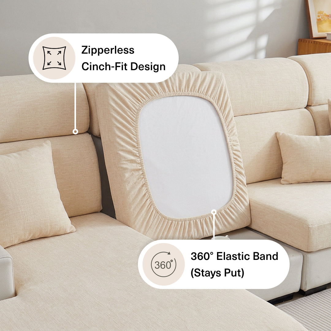Diagram of a Cream Miracle Sofa Cover Plush seat cover lifted to show its zipperless cinch fit and elastic band