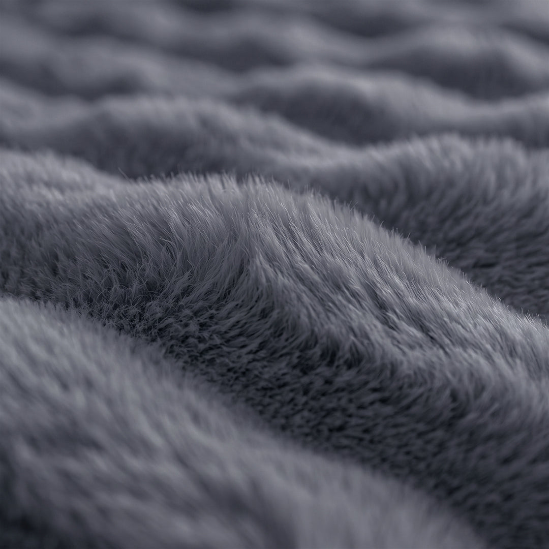 Close-up of the bubble-textured faux fur of the Black Sesame Nora Mink Magic Sofa Blanket