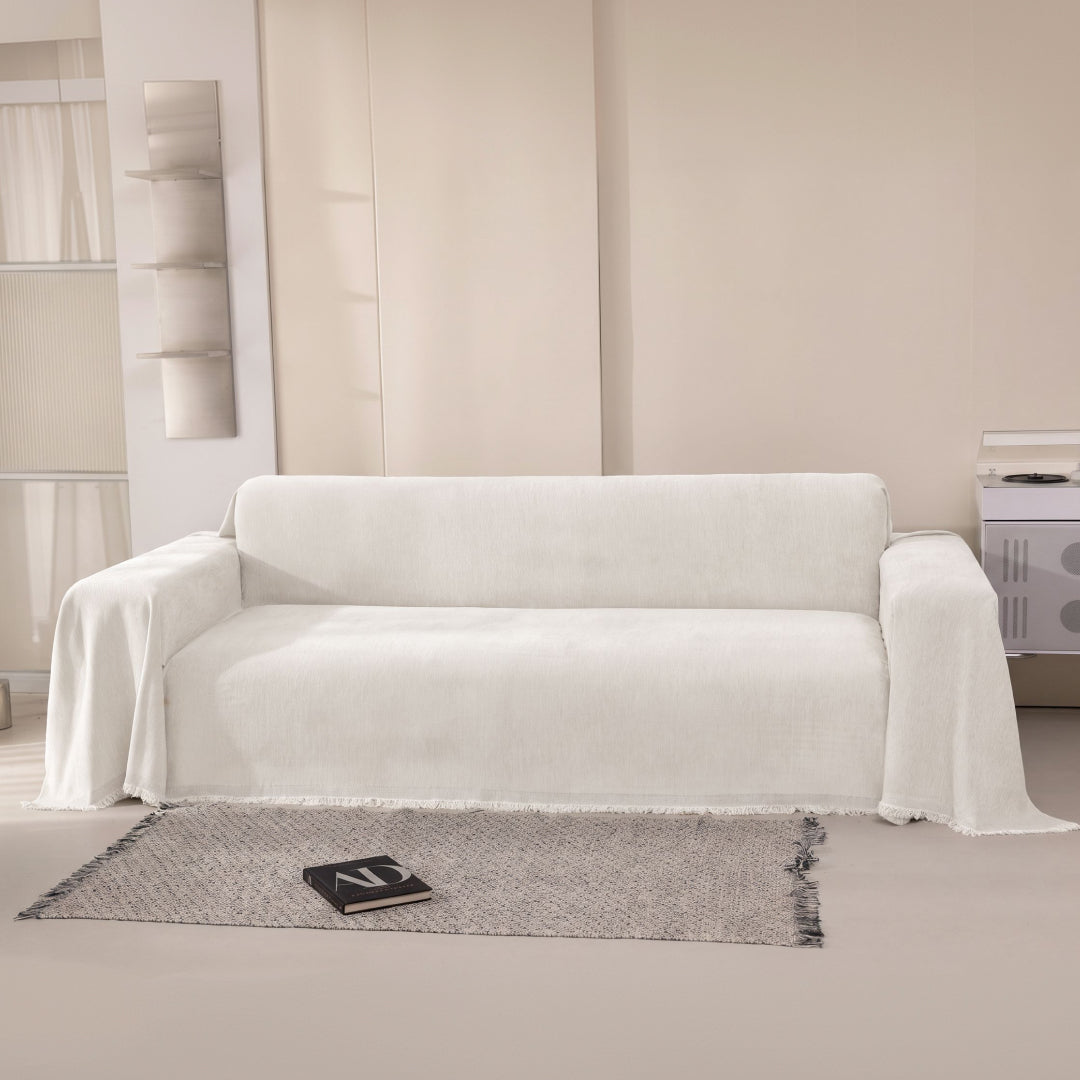 Vanilla Sophie Plush Magic Sofa Blanket draped over a whole sofa