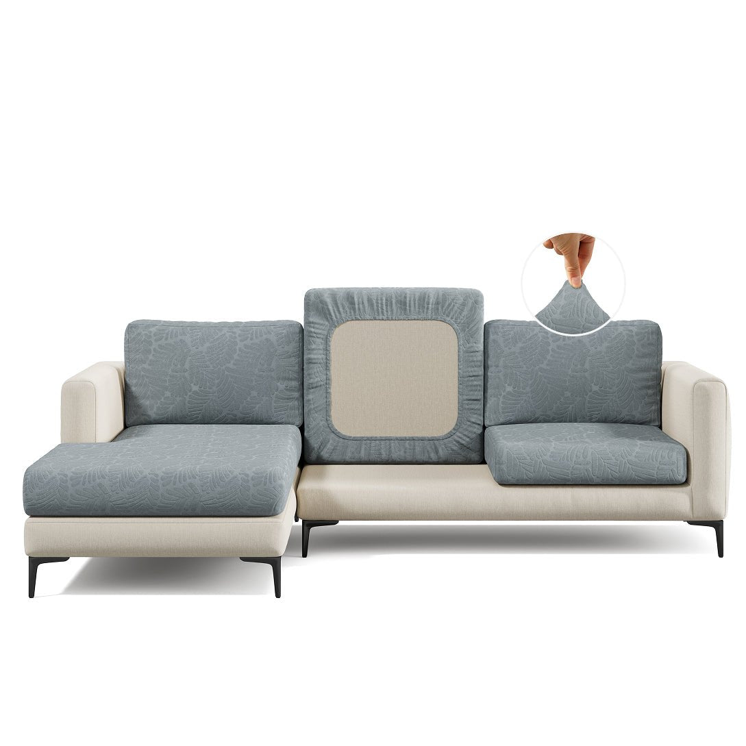 Leaf pattern Magic Sofa Cover in Chrome Grey on a sectional sofa, white background