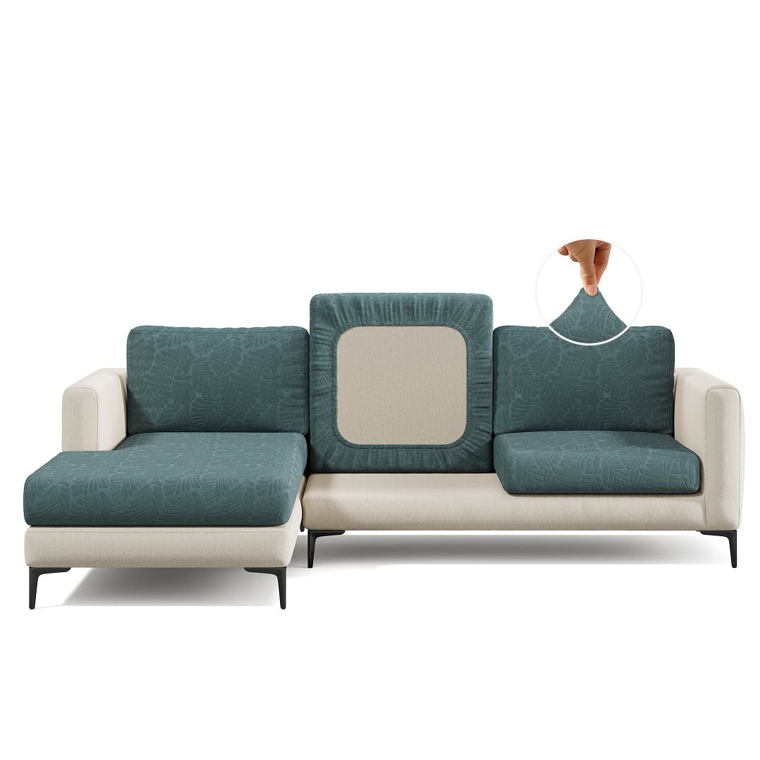 Leaf pattern Magic Sofa Cover in Cypress Green on a sectional sofa, white background