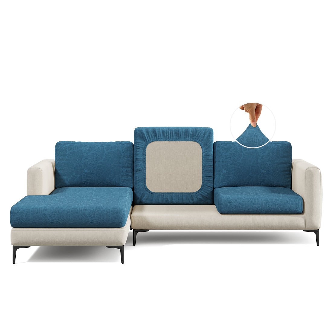 Leaf pattern Magic Sofa Cover in Steel Blue on a sectional sofa, white background