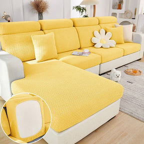 Yellow sectional couch cover in a contemporary living room setting.
