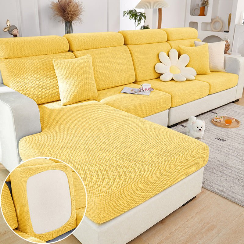 Yellow sectional couch cover in a contemporary living room setting.