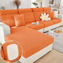 Orange sectional couch cover in a contemporary living room setting.