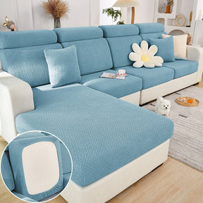 Light blue sectional couch cover in a contemporary living room setting.