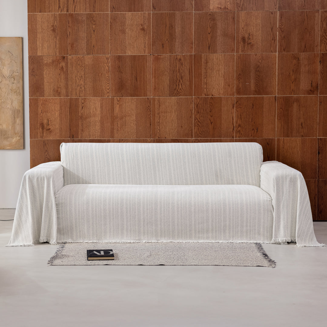 Sesame Lena Herring Magic Sofa Blanket draped over a whole sofa, front view