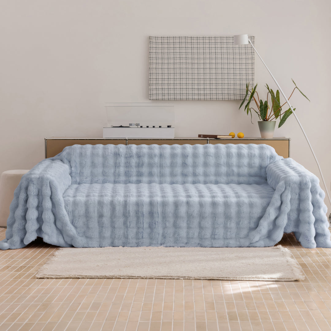 Celtic Salt Nora Mink Magic Sofa Blanket draped over a sofa