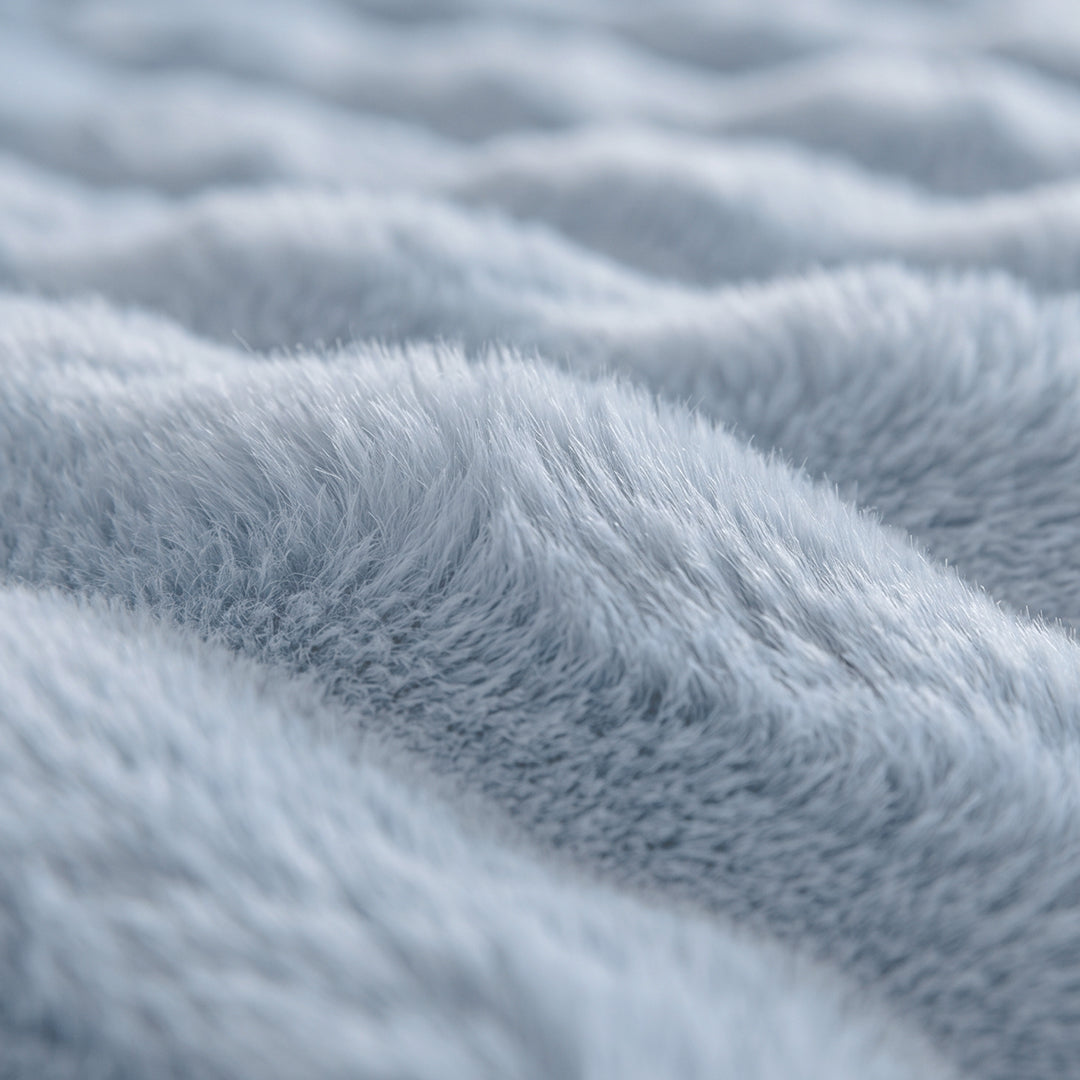 Close-up of the bubble-textured faux fur of the Celtic Salt Nora Mink Magic Sofa Blanket