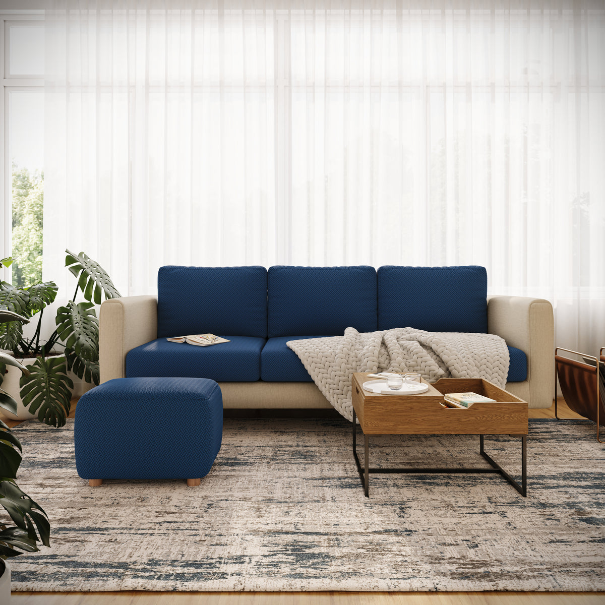 Magic Ottoman Cover Classic in Navy Blue on an ottoman in a living room
