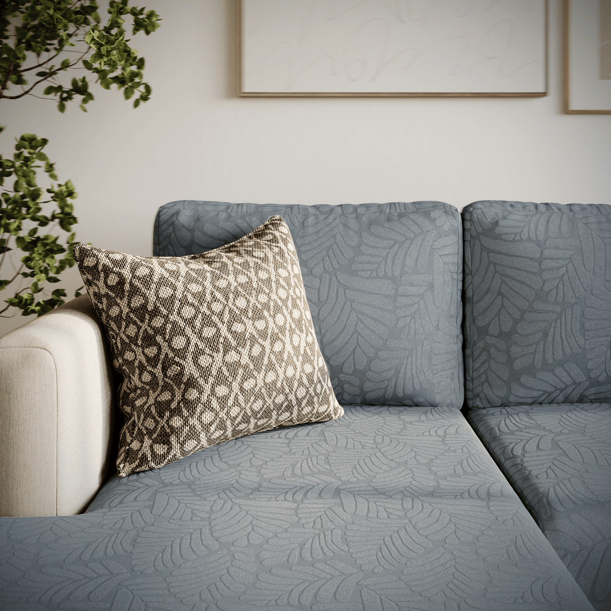 Detail of a Leaf pattern Magic Sofa Cover in Chrome Grey on a sofa cushion