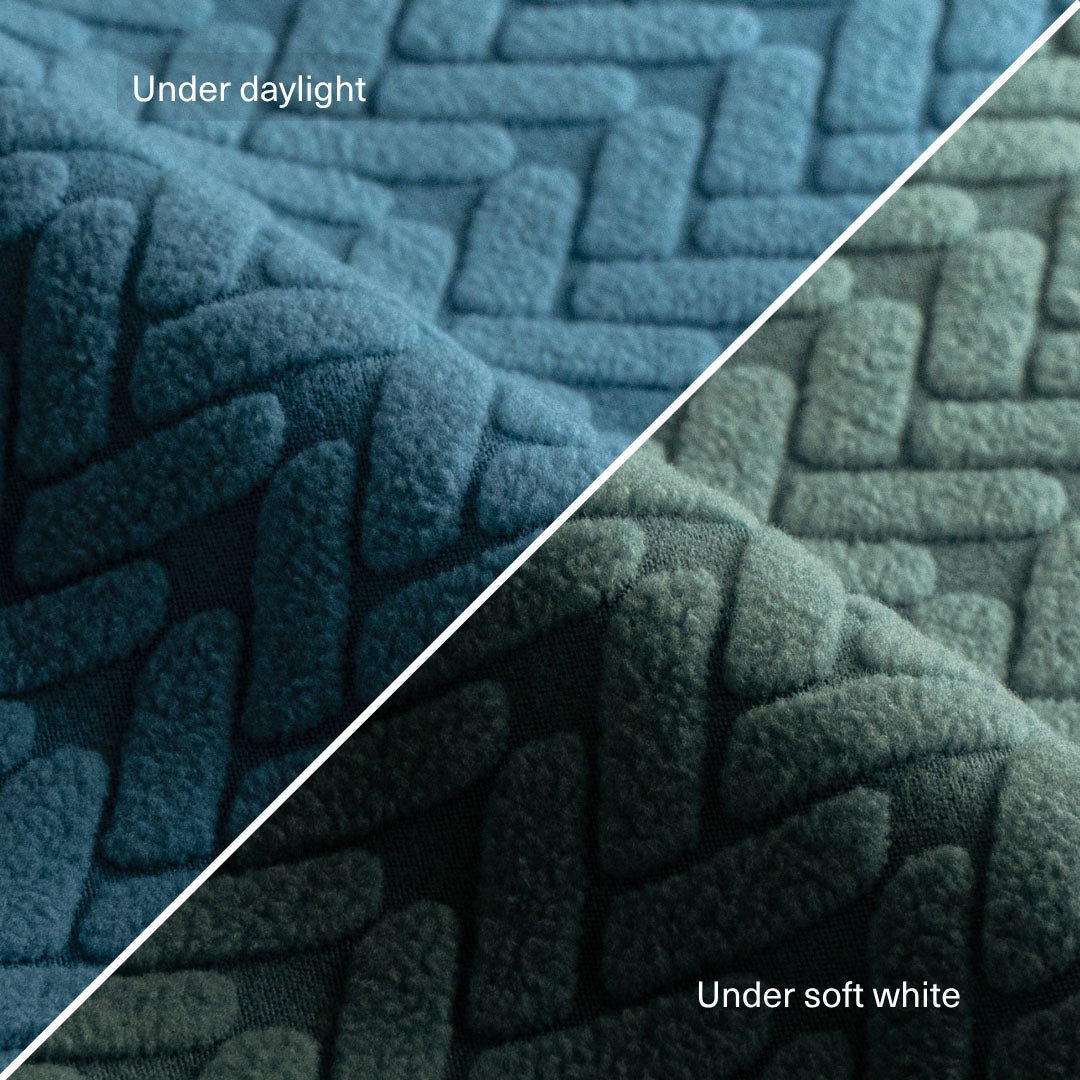 Wheat pattern fabric swatch in Aqua Blue compared under daylight and under soft white light