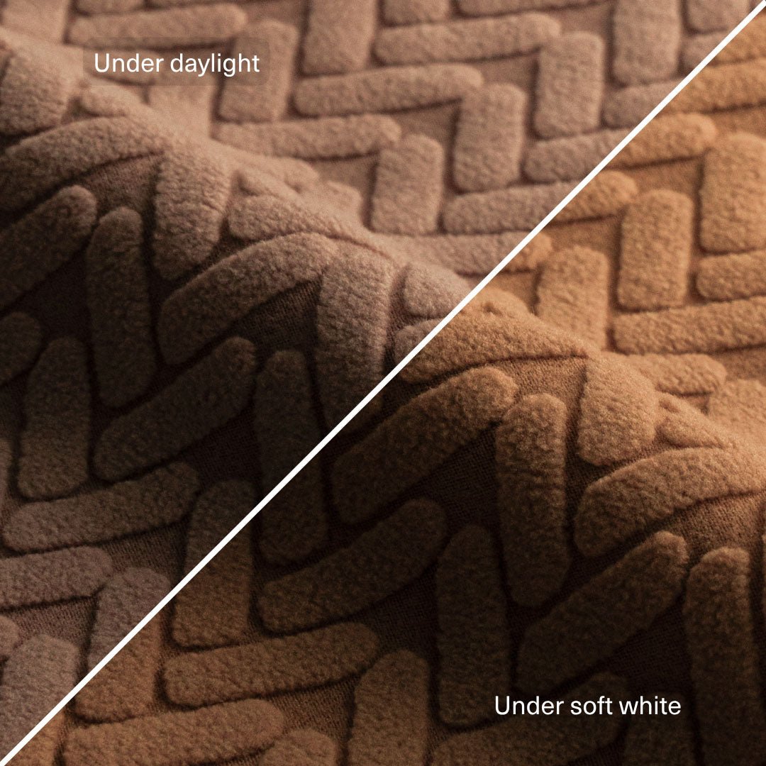 Wheat pattern fabric swatch in Camel Brown compared under daylight and under soft white light