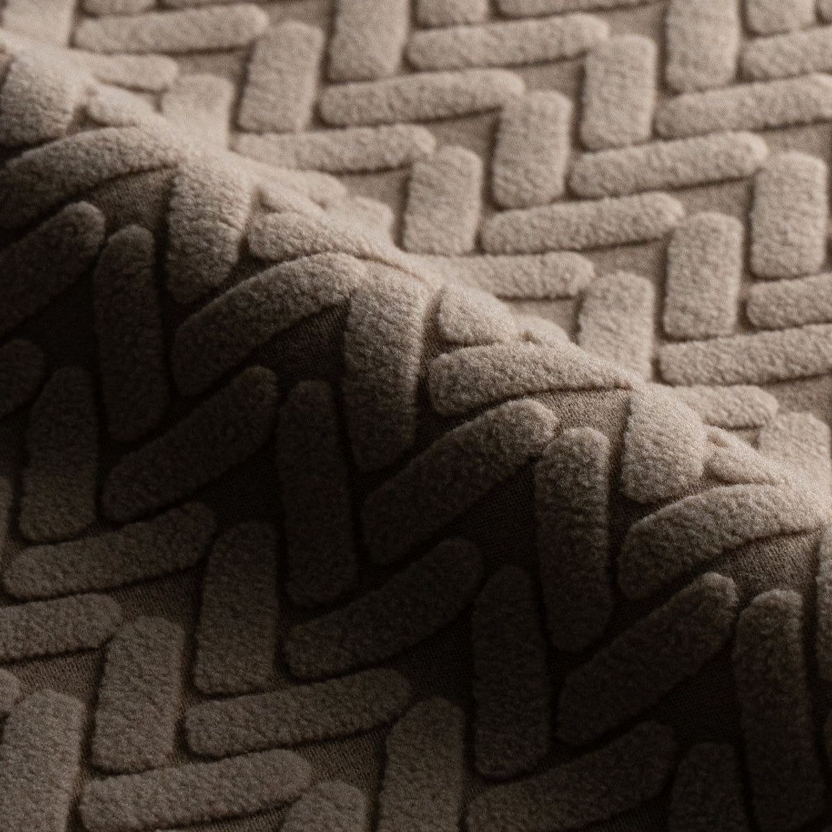 Close-up of folded Wheat pattern fabric swatch in Camel Brown