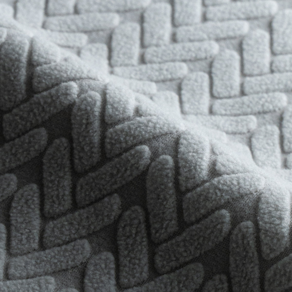 Folded Wheat pattern Magic Sofa Swatch fabric in Chrome Grey showing its raised texture