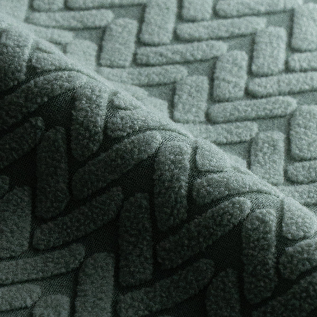 Folded Wheat pattern Magic Sofa Swatch fabric in Cypress Green showing its raised texture