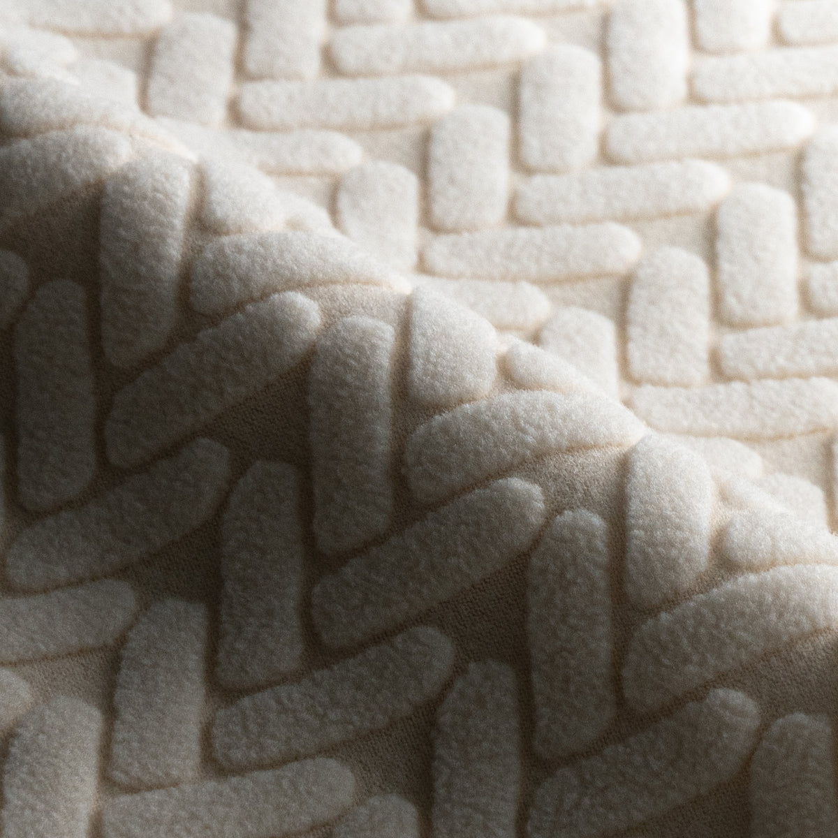 Close-up of folded Wheat pattern fabric swatch in Ivory Beige