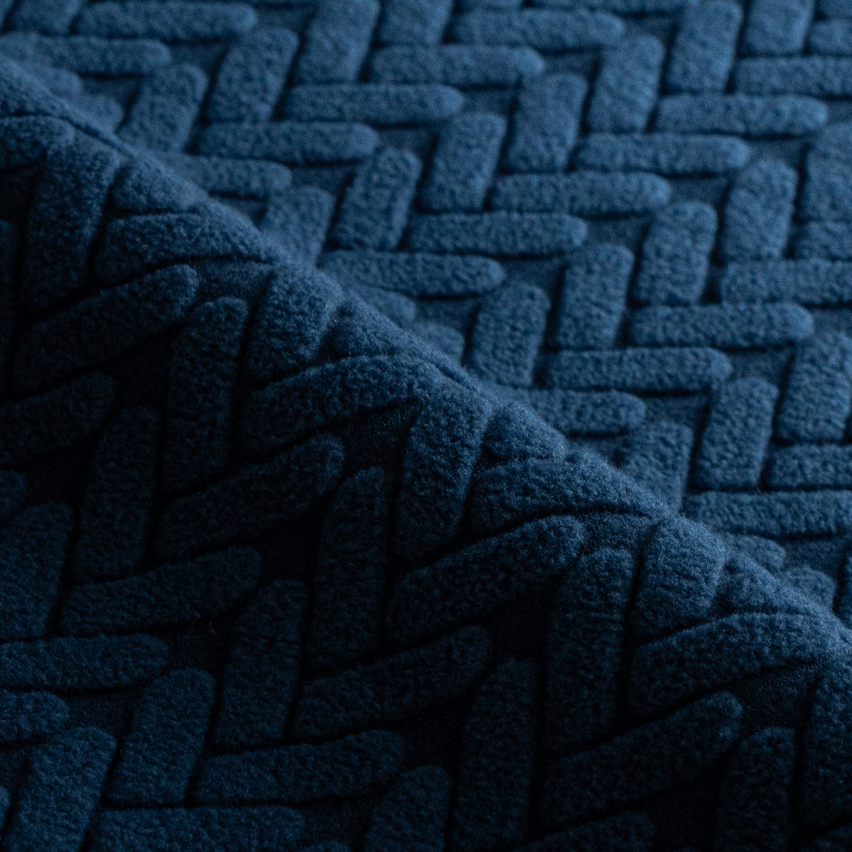 Close-up of folded Wheat pattern fabric swatch in Navy Blue