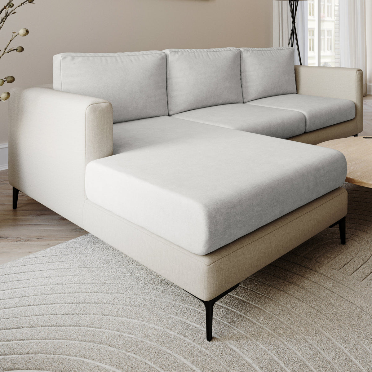 Smore faux suede Miracle Sofa Cover in Earl Grey on a chaise sectional in a living room