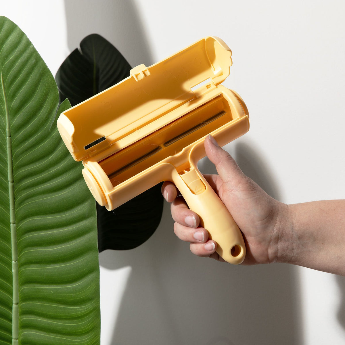 Magic Pet Hair Remover with its lid open to show the inner hair chamber