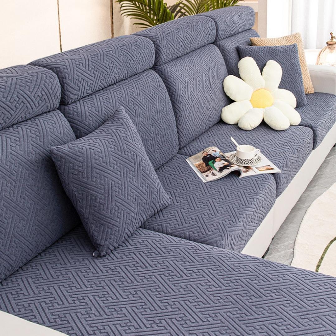 Metal grey couch and sofa protector in a contemporary living room setting.
