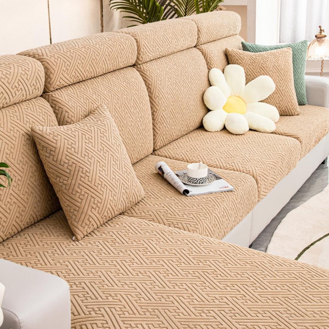 Brown couch and sofa protector in a contemporary living room setting.