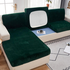 Green modern couch cover in a contemporary living room setting.