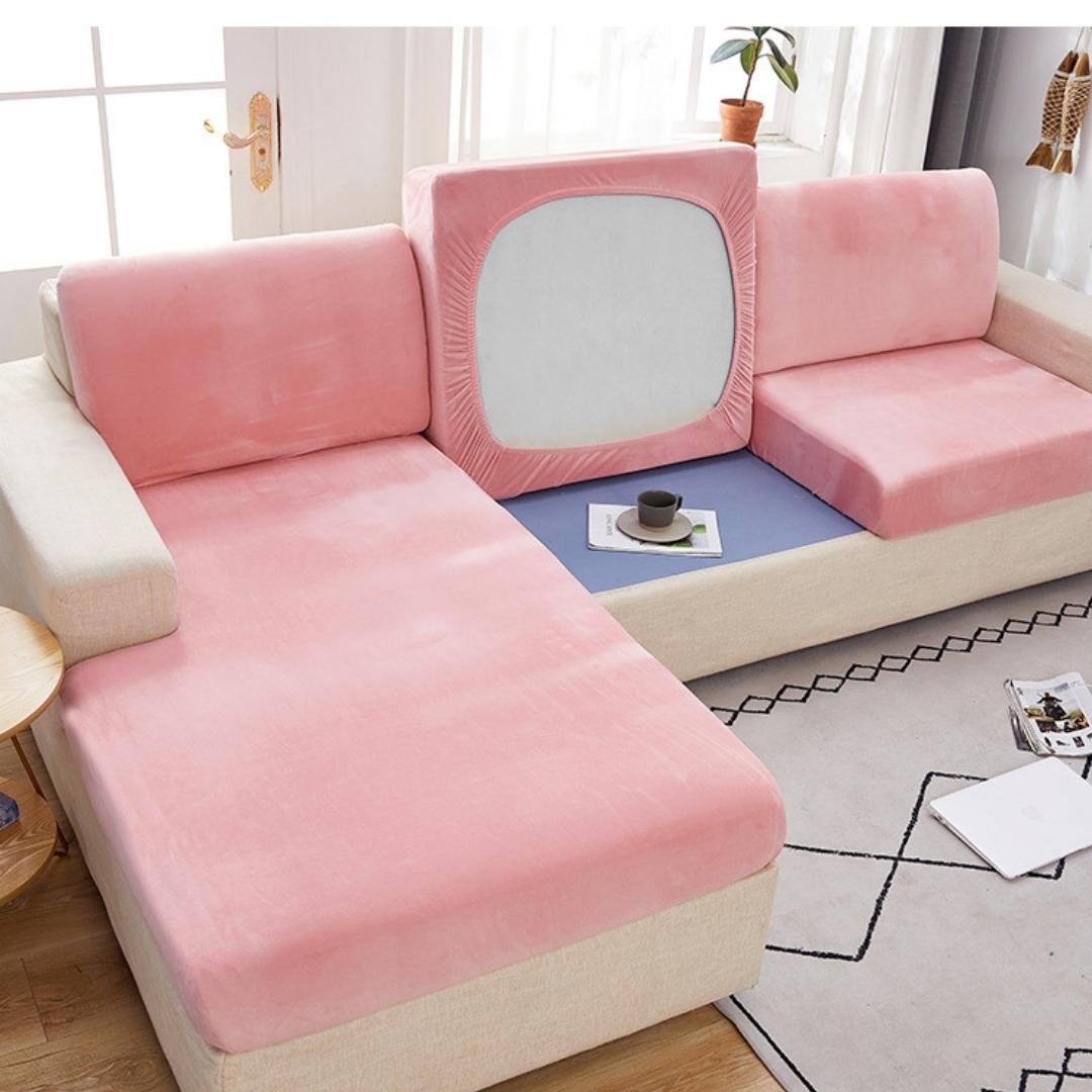 Pink modern couch cover in a contemporary living room setting.