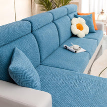 Blue couch and sofa protector in a contemporary living room setting.