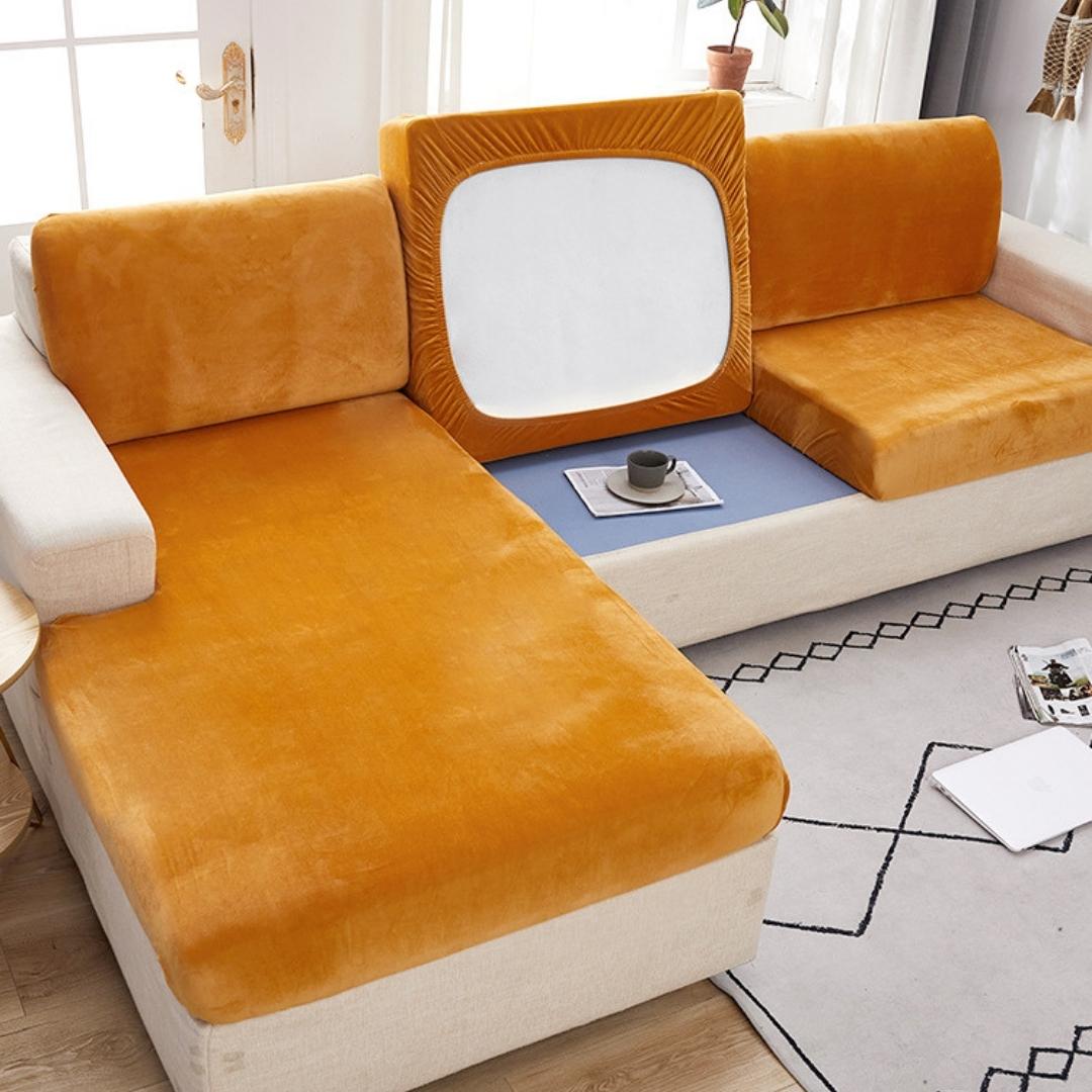 Orange modern couch cover in a contemporary living room setting.