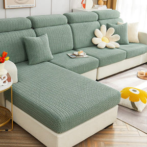 Green dog couch cover in a contemporary living room setting.