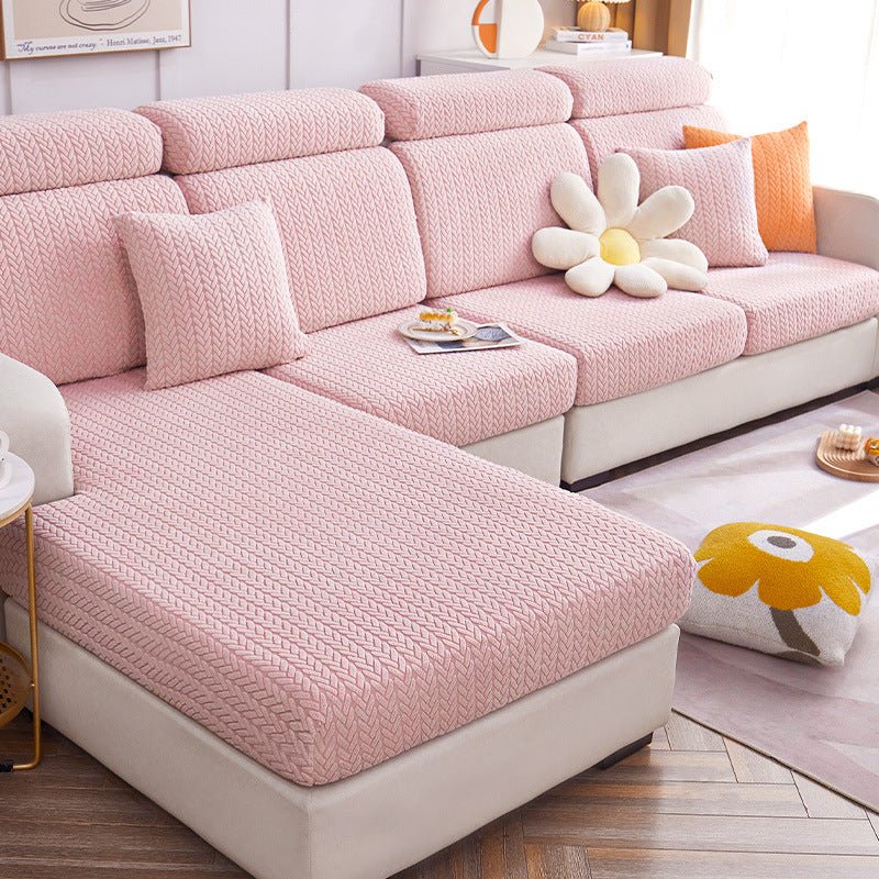 Pink dog couch cover in a contemporary living room setting.