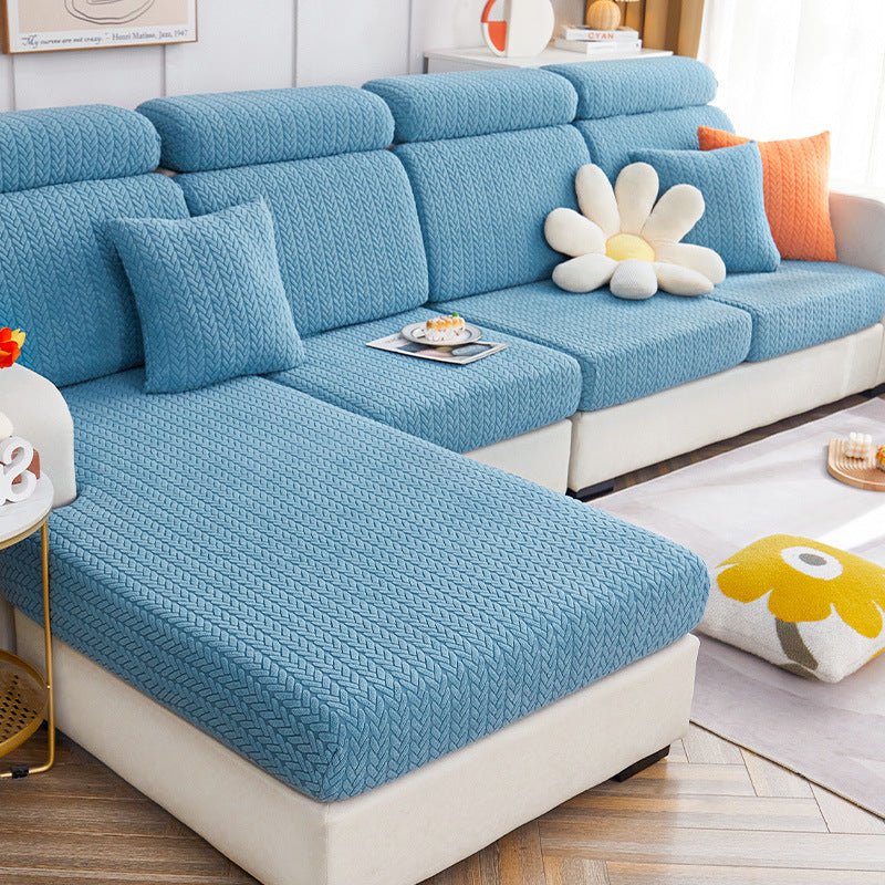 Light blue dog couch cover in a contemporary living room setting.