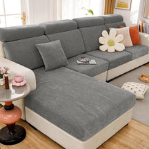 Dark grey waterproof couch cover in a contemporary living room setting.