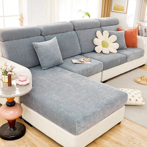 Grey waterproof couch cover in a contemporary living room setting.