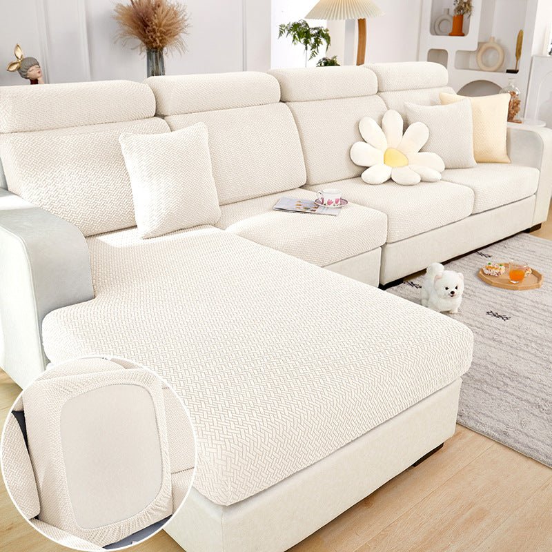 White sectional couch cover in a contemporary living room setting.