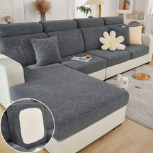 Dark grey pet couch cover in a contemporary living room setting.