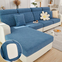 Dark blue pet couch cover in a contemporary living room setting.