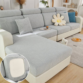 Light grey pet couch cover in a contemporary living room setting.