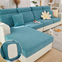 Light blue pet couch cover in a contemporary living room setting.