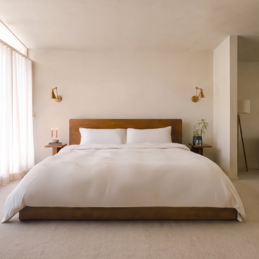 FurAway Essential Bundle in Cloud White, folded bamboo sateen sheets on two pillowcases, with a fabric close-up