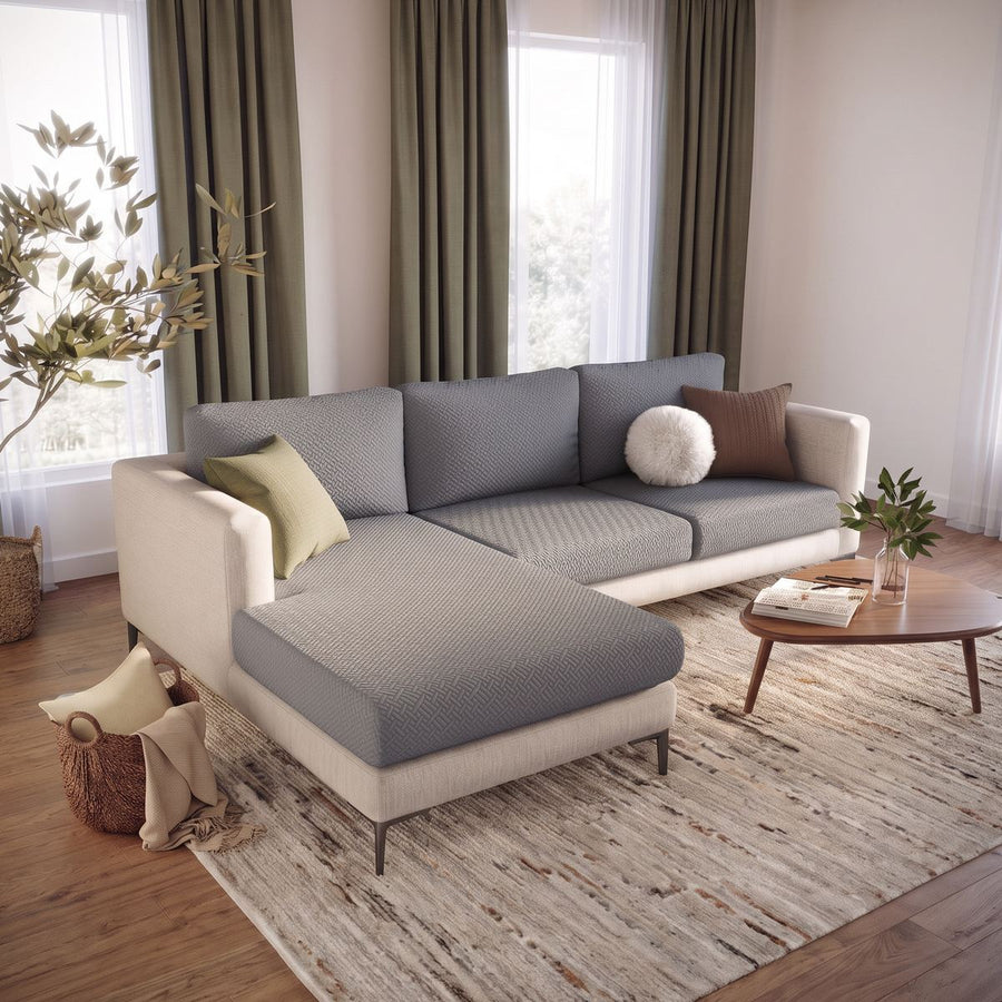 Magic Sofa Cover Classic in grey on a cream chaise sectional in a sunlit living room